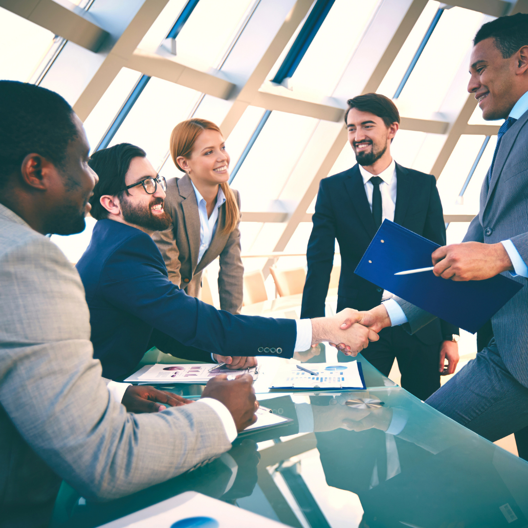 Businessmen shaking hands in an office