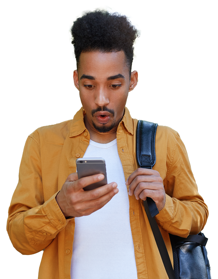 Young man of color watching a cellphone surprised with a bagpack