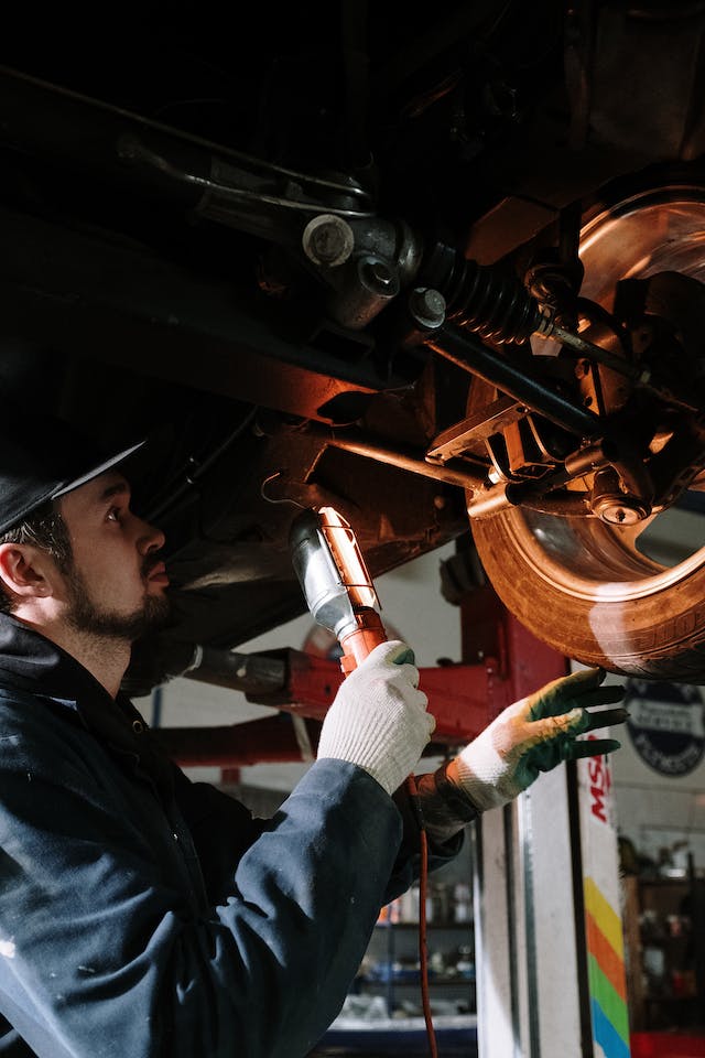 Automotive technician working on a car