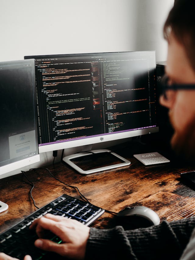 Insurance coding technician working on a computer